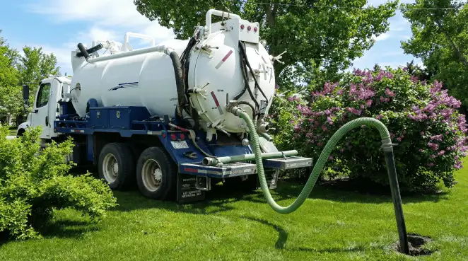 Professional vacuum truck performing residential drainage and septic maintenance in Phoenix, AZ