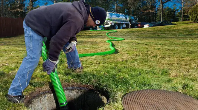 Service technician performing residential septic pumping and drainage maintenance in Phoenix, AZ